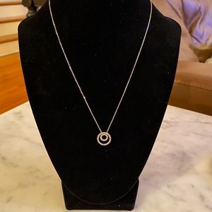 Diamond and 14-karat white gold pendant.